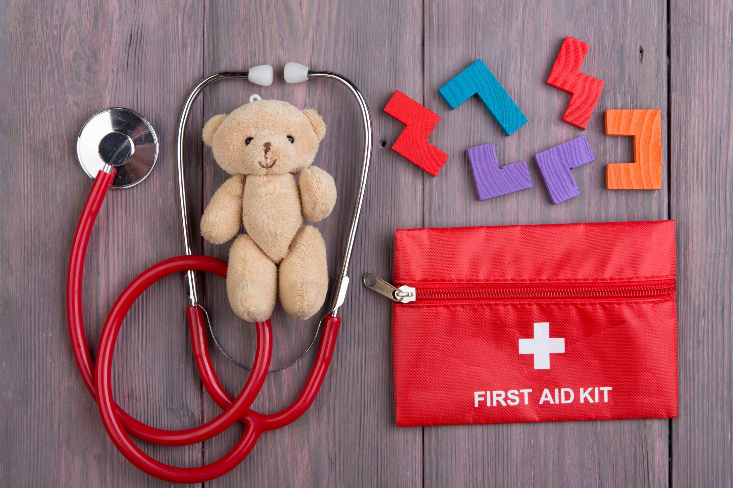 pediatric first aid kit with teddy bear and toys